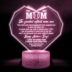 a pink light up lamp with the words to my mom and an image of a baseball bat