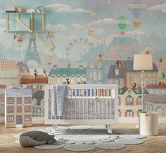 a baby's room with a wall mural that has hot air balloons in the sky