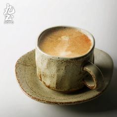 a cup of coffee on a saucer