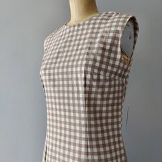 "Almost Grey or Almost Brown with White Gingham Pattern. Zips down the back. Perfect for season transitions. No stretch. Small spot on side seam. See photo. Pit to Pit: 17.5\" Waist: 14.5 Hips: 19.5 Length:  40 shoulder to hem  Measurements taken flat and in inches. Double when necessary.  For Full details go to my shop policies. Message me with questions.  There are NO RETURNS. Items over $50 are shipped priority which includes insurance. At this time I cannot ship items to certain EU countries due to my No Return Policy.   Check out my shop page for more vintage and for shop policies: http://www.etsy.com/shop/rocketanywayvintage Instagram has all the lastest items coming to the shop! @rocketanywayvintage Also like my FB page. I post about sales and new items: https://www.facebook.com/roc Eu Countries, Gingham Pattern, Dress Clothes For Women, Shop Policies, Spot On, Fitted Dress, Over 50, Gingham, Return Policy