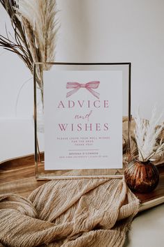 there is a sign that says advice and wishes next to some dried plants on a tray