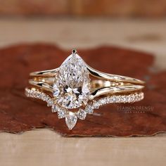 a close up of a diamond ring on a leaf