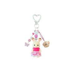 a keychain with a bunny holding a cupcake and a heart shaped object