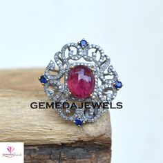 Pave Diamond Designer Ring, Ruby Gemstone Silver Ring, Diamond Gemstone Ring, 925 Silver Jewelry, Silver Sapphire Ring, Wedding Jewelry Gift Gross Weight: 7.73 gram Diamond Weight: 0.95 Cts Gemstone Weight: 7.25 Cts Ring Size: 29X28 MM NOTE:- All The Products Are Designed And Manufactured In My Workshop By Me & My Team. Shown Products Are Purely Handmade. Custom Orders Are Open Handly Accepted. We Are the Perfect Choice For Any Custom Jewelry Manufacturing. For Bulk Orders Please Message me. Ruby And Diamond Multi-stone Round Ring, Elegant Ruby Ring With Diamond Settings, Dazzling Ruby Ring, Exquisite Sterling Silver Diamond Ring With Gemstone, Fine Jewelry Ruby Multi-stone Rings, Sterling Silver Multi-stone Diamond Ring, Sterling Silver Round Gemstones For Wedding, Formal Rings With Cubic Zirconia Stones, Formal Cubic Zirconia Rings With Stones