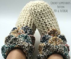 there is a pair of crocheted slippers on top of someone's feet