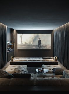 a living room with two couches and a large screen