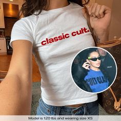 "Cult Classic Charli XCX" Graphic Slogan Printed On Aesthetic Retro Vintage 90s Y2k Baby Tee Shirt with our own unique font.  🎨 Available in White, Light Pink, Light Blue, Navy, Black. If you need a different color, please let us know! (Ash, Red, Sport Grey & Green)  🎁 Our baby tees are perfect gift for her or him offering timeless fashion and versatility that anyone will cherish. Baby tees, popular in the '90s, have short sleeves and a slightly cropped body, giving a flattering feminine shape Y2k Fitted T-shirt For Concert, Fitted Retro T-shirt With Logo Print, Y2k Short Sleeve Club T-shirt, Y2k Style Fitted Short Sleeve T-shirt, Y2k Fitted Short Sleeve Tops, Trendy Short Sleeve T-shirt For Club, Fitted Casual Tops For Club, Y2k Letter Print Top For Concerts, Y2k Style Letter Print Top For Concerts