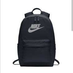 This Nike Backpack For Women, Men, Or Kids Combines Simplicity And Functionality With Its Clean Design. Padded Shoulder Straps Add An Extra Element Of Comfort While You Carry Your Gear. 100% Polyester Densely Woven Polyester Provides Heavyweight Support A Zippered Main Compartment Offers Room For Gear Padded Back Panel And Padded, Ergonomically Shaped Shoulder Straps For Comfortable Carrying Interior Sleeve Stores A Laptop Up To 15 Zippered Front Pouch Provides Small-Item Storage A Haul Loop At The Top Gives An Alternative Carrying Option Contrast Welded Swoosh Design Trademark Laptop Sleeve Fits Most 15" Laptops Dimensions: 17"H X 12"W X 6"D; Approx. 1,224 Cubic Inches Color: Obsidian Black Nike Backpack, Nike Sports Bag, Bucket Backpack, Polka Dot Bags, Gym Sack, Nike Backpack, Nike Max, Nike Bags, Red Backpack