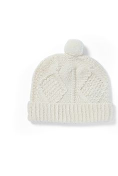 Stay warm and experience Aran’s enchantment with the Kinard Ski Hat. 

Part of the Kinard diamond stitch range, this ski hat features a beautiful Aran diamond stitch filled with moss stitch, between corded and rope cables. As well as this, an expertly crafted Aran pom pom adorns the top for added texture and Aran flair. 

Hand knit here in Ireland, the Kinard Ski Hat is a truly perfect piece of Ireland to carry with you through life’s journey. Aran Blanket, Aran Hat, Aran Cardigan, Ski Hat, Aran Sweater, Ski Hats, Shetland Wool, Moss Stitch, Wool Shop