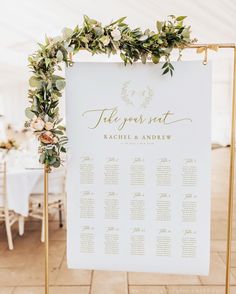 a table plan with greenery and flowers on it