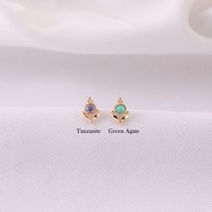 Metal: 14K solid gold, Not Plated or Gold Filled Available Gold color: Yellow gold  Stone: Green Agate/Tanzanite Back Thickness: 0.82mm (20G) , 1.0mm (18G), 1.2mm (16G) Stamp: 14K on top or 14K gold back, no stamp on titanium back, ★Sold as single piece ★Threadless Push Pin (Flat Back) ★ We have two different materials of Push back for you choose: ● One is 14K solid gold with length : 6mm(standard), 8mm, 10mm (long)  ● Another is implanted grade titanium push back in size 5mm(short) 6mm 8mm and Dainty Gold Earrings With Gemstone Accents, 14k Gold Gemstones With Gemstone Accents, Gold Gemstones With Accents For May Birthstone, Gold Gemstones For May Birthstone, Dainty Gold Gemstones With Accents, Stud Piercing, Tanzanite Gemstone, Green Agate, Gold Floral