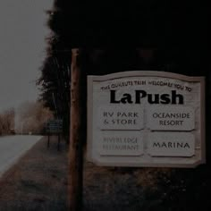 a sign on the side of a road that says la push and oceanside resort