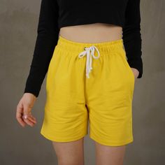 Yellow cotton shorts are made of high quality materials, durable enough for your daily wearing. Stylish and fashion design make you more attractive and handsome. Stunning color, relaxed fit, and breathable pure cotton fabric, are all you need for a pair of shorts in hot summer days. Two pockets make them more casual and practical. You can wear women cotton shorts for running, cycling, walking, yoga, nature or the beach or even relaxing at home.  Our bright yellow shorts will make you feel special even in the crowd. Once you wear them onyo will not want to take them off. ---FABRIC--- Due to its breathability, it is a fabric that has minimal sweating properties. It has a texture that can easily be a reason for choice in hot conditions. Due to its natural structure, it does not cause an aller