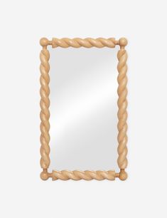 a mirror made out of wood and rope