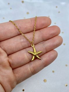 A lovely starfish necklace ⭐️ PENDANT SIZE: 11/16 in. LENGTH: Comes on your choice of 16", 18", 20", or 22" gold plated stainless steel chain. Chain is approximately 1.5mm wide. MATERIALS: Gold plated stainless steel charm, gold plated stainless steel chain, gold plated stainless steel jump rings, gold plated stainless steel clasp * *Stainless steel is hypoallergenic and tarnish resistant so this necklace is safe for those with sensitive skin! It will not turn green, fade, or rust if exposed to Gold Stainless Steel Jewelry With Star Charm, Yellow Gold Starfish Necklace As Gift, Dainty Gold Starfish Charm Necklace, Gold Jewelry With Starfish Charm For Gift, Gold Jewelry With Starfish Charm As A Gift, Starfish Charm Pendant Necklace For Gift, Starfish Charm Pendant Necklace Gift, Gold Starfish Charm Necklace Gift, Gold Starfish Necklace With Lobster Clasp