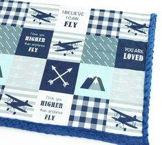 a blue and white blanket with airplanes on it that says i love you so much