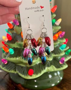 Handmade Christmas Dangle Earrings. Nothing screams Christmas festivities more than these adorable Christmas Lightbulb Earrings. They are so cute and lightweight. Excellent accessory to wear to all of your holiday parties and Christmas festivities! Nickel-free Earrings For Christmas Party, Nickel-free Christmas Party Jewelry, Festive Dangle Earrings For New Year, Festive New Year Dangle Earrings, Holiday Multicolor Earrings As A Gift, Holiday Multicolor Earrings Perfect For Gifts, Holiday Multicolor Earrings As Gift, Multicolor Earrings For Holiday Gifts, Multicolor Earrings For Christmas Gift