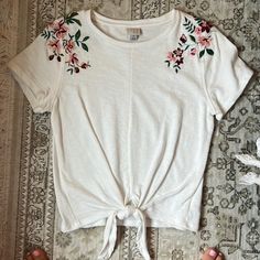 Cotton T-Shirt Emboirdered Shoulders, Spills Over To Back Tie Bottom Thick Material Nwot Size S Target White Crew Neck Top With Floral Embroidery, Casual Crew Neck Tops With Embroidery, Casual Embroidered T-shirt For Summer, White Floral Embroidery Short Sleeve Top, White Floral Embroidered Short Sleeve Top, Cotton T-shirt With Embroidery For Spring, White Embroidered T-shirt For Summer, Casual White Top With Floral Embroidery, White Floral Embroidered T-shirt For Spring