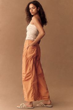 Too hot to barrel . Defined by a cool, curved leg that gently tapers at the ankle for a nonchalant-yet-elegant offering, the barrel-leg look is a standout silhouette. | Parachute Curve Barrel Pants by Pilcro in Orange, Women's, Size: 26, Cotton/Lyocell/Tencel at Anthropologie Chic Tapered Leg Parachute Pants For Summer, Chic Summer Parachute Pants With Tapered Leg, Chic Parachute Pants With Pockets, Chic Parachute Pants For Workwear, Spring Chic Straight Parachute Pants, Chic High-waisted Relaxed Fit Parachute Pants, Spring Tapered Cropped Bottoms, Chic Fall Parachute Pants, Chic Fitted Wide-leg Parachute Pants