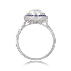 "Notable for it's size, this ring features a 4.49 carat natural Sapphire. Along the shoulders are two additional step-cut sapphires, followed by graduating baguette-cut diamonds. This ring is vintage, circa 1960. ✦ SAPPHIRE SPECIFICATIONS: Sapphire Cut: Cushion Cut Sapphire Weight 4.49 Carats ✦ ENGAGEMENT RING SPECIFICATIONS: Ring Material: Platinum Stones: Diamond, Sapphire ✦ WHAT COMES IN YOUR SHIPMENT: - Your Engagement Ring - Quality Ring Box - Jewelry Cleaner - UGL Certificate ✦ WHY SHOP WI Gia Certified Cushion Cut Sapphire Ring In Platinum, Gia Certified Emerald Cut Sapphire Ring In Platinum, Art Deco Emerald Cut Sapphire Ring In Platinum, Art Deco Sapphire Ring With Baguette And Brilliant Cut, Art Deco Sapphire Diamond Ring With Halo Setting, Fine Jewelry Platinum Cushion Cut Sapphire Ring, Luxury Sapphire Baguette Cut Ring With Halo Setting, Platinum Diamond Ring With Asscher Cut Gemstone, Asscher Cut Diamond Ring In Platinum