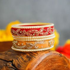 Elevate your jewellery game with our handcrafted velvet pearl bangles with zari and mirror work, exuding elegance and charm. Unveil the luxury with 3 bangles in every order, thoughtfully presented in delicate potli bags. Adorn yourself with the timeless allure of pearls and make a statement that resonates. Don't wait, shop now! Note: Our product is available in multi colours, but colour choice is not available. We will send them based on availability. Leave a note at checkout, and we'll try to a Kundan Bracelets For Festivals And Gifts, Traditional Bracelets With Gota Work For Gift, Traditional Adjustable Bracelets With Gota Work, Adjustable Traditional Bracelets With Gota Work, Kundan Traditional Wear For Diwali Gift, Traditional Bracelets For Eid, Diwali Gift Chandbali Bracelets, Traditional Festive Bracelets For Puja, Adjustable Wedding Jewelry With Zari Work