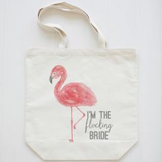 a pink flamingo bag with the words let's flamingople printed on it