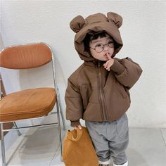 Introducing our Hooded Puffer Bear Jacket, the perfect blend of warmth, style, and cuteness for your little ones. This jacket is not just a winter essential; it's a delightful fashion statement that will make your child the star of any outing. The standout feature is the lovable bear design on the hood, complete with fuzzy bear ears, adding an element of charm that kids adore. Playful Hooded Outerwear With Adjustable Hood, Cute Outerwear With Fleece Lining For Cold Weather, Playful Hooded Outerwear For Cold Weather, Cute Outerwear With Fleece Lining For Winter, Cute Winter Outerwear With Fleece Lining, Playful Hooded Outerwear For Playtime, Cute Hooded Outerwear For Outdoor, Hooded Outerwear With Fleece Lining For Playtime, Cute Hooded Outdoor Outerwear