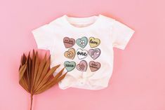 Valentines Day Birthday Shirt Valentines Day 1st Birthday - Etsy Cute Short Sleeve Birthday Shirt, Fun Short Sleeve Tops For First Birthday, Graphic Print Long Sleeve Top For First Birthday, Playful Heart Graphic Tops For Spring, Cute Shirt With Graphic Print For First Birthday, Cute Short Sleeve Shirt For First Birthday, Cute Graphic Print Shirt For First Birthday, Playful Short Sleeve Top For First Birthday, Playful Graphic Print T-shirt For Valentine's Day