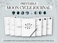 the printable moon cycle journal is open and ready to be filled with notes, cards, and other items