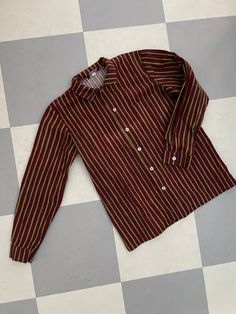 This is a preppy vintage shirt from Finnish company Marimekko. Classic style Jokapoika shirt, child approx 150-160cl. (size label is missing). Bordeaux and Green stripes. Very nice design, pocket and classic metal buttons in the front.  Nice crispy cotton cloth. very Good condition.  Don't hesitate to ask for Measurements in CM or inches.  Chest is 100cm. Made in Suomi Finland. ♪♫♬ Fall Long Sleeve Shirt With Striped Collar, Fall Daywear Shirt With Striped Collar, Green Long Sleeve Shirt With Striped Collar, Fall Season Striped Collar Shirt For Daywear, Cotton Long Sleeve School Shirt, Casual Cotton Blouse For School, Classic Cotton School Blouse, Preppy Collared Cotton Blouse, Retro Long Sleeve Tops For School