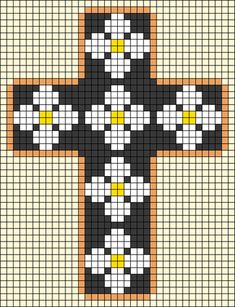 a cross made out of squares with yellow and white flowers in the center on top