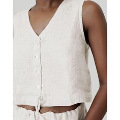 Revive 90s nostalgia with our Reistor Textured Linen Cropped Vest Top, a timeless design that perfectly blends retro charm with contemporary style. This V-neck vest features a regular fit and shell buttons at the front, exuding a classic yet trendy appeal. Embrace the versatility of this piece, ideal for pairing with skirts,pants or shorts for summer outings or layering under jackets for a chic look. Cropped Vest Top, Linen Shorts Women, Boxy Crop Top, Shirt Linen, Vest Crop Top, Cropped Vest, Wide Leg Linen Pants, 90s Nostalgia, Vest Shirt