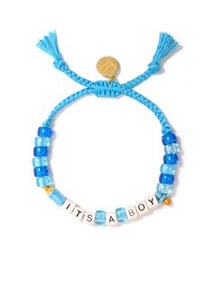 Celebrate the arrival of your little one with our It's A Boy Bracelet! Adorned with blue threadwork, a pacifier charm, and a baby bottle charm, this bracelet is the perfect (and eco-friendly) way to reveal your baby's gender. Show off your excitement with this fun and playful accessory. 6" Adjustable blue threadwork Drawstring closure (extendable up to 8") Gold plated brass hardware Glass charms Ceramic charms Handmade in New York City and Puerto Rico. Due to the handmade nature of our products, some charms may vary in color and style or be replaced if unavailable. Please allow 5-7 business days for production. Playful Adjustable Blue Friendship Bracelets, Playful Blue Beaded Bracelets For Birthday, Personalized Blue Charm Bracelet For Birthday, Handmade Playful Blue Friendship Bracelets, Handmade Blue Playful Friendship Bracelets, Playful Handmade Blue Friendship Bracelets, Handmade Blue Friendship Bracelets Playful Style, Blue Handmade Friendship Bracelets Playful Style, Hypoallergenic Blue Beaded Bracelets For Birthdays