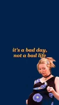 a pregnant woman holding her belly in front of a blue background with the words it's a bad day not a bad life