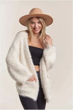 Stay cozy and stylish in our One Size Ivory Open Front Fuzzy Cardigan! Made with soft and fuzzy fabric, this cardigan features a touch of sparkle with lurex threads and convenient pockets. Perfect for lounging or layering, it's a must-have addition to any wardrobe. 55%NYLON 45% POLYESTER Fuzzy White Cardigan Outfit, White Cardigan Outfit, Fuzzy Fabric, Thrift Shop Finds, Cardigan Outfit, Fuzzy Cardigan, Thrift Shop, Cardigan Outfits, Sweater Tank Top