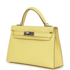 This Kelly, in the Sellier style, is in Limoncello Chevre leather with Palladium hardware, has tonal stitching, two straps with front toggle closure, a single rolled handle, and a removable shoulder strap.The interior is lined with Limoncello lambskin leather and has one open pocket on the back wall. Collection: BOrigin: FranceCondition: New and never wornAccompanied by: Hermes box, Hermes dustbag, shoulder strap, shoulder strap dustbag, felt, carebookMeasurements: 7.5" width x 4.5" height x 2.2" depth; 2.5" handle drop (18" shoulder strap drop) Classic Yellow Textured Leather Bag, Classic Yellow Bag With Silver-tone Hardware, Classic Yellow Bags With Silver-tone Hardware, Hermes Kelly Sellier, Kelly Sellier, Hermes Birkin 25, Hermes Birkin 30, Hermes Box, Birkin 25