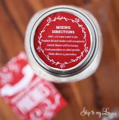 a red and white label on a silver jar