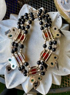 Stunning Bold Beautiful Sterling Silver Carnelian Green and Black Onyx Vintage Bib Festoon Necklace This necklace is absolutley stunning , Not for the faint at heart Measures aprox 16 inches around , necklace has a 2 inches chain extension Each pendant measures over 3 inches See matching earrings in link below https://www.etsy.com/listing/744424320/f?ref=shop_home_active_1&frs=1 Traditional Black Beaded Necklaces With Natural Stones, Unique Black Polished Bead Jewelry, Unique Black Jewelry With Polished Beads, Artisan Black Onyx Necklace, Unique Black Necklaces With Polished Beads, Black Artisan Jewelry With Gemstone, Black Natural Stones Beads For Jewelry Making, Handmade Black Bohemian Beads, Gems And Cabochons, Vintage Black Jewelry With Natural Stones