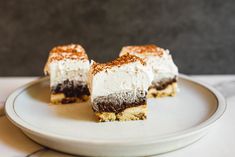 two pieces of cake sitting on top of a white plate