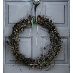 a wreath is hanging on the front door