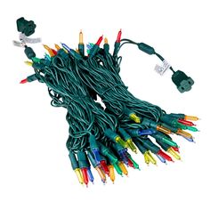 a bunch of green and red christmas lights on a white background with the cord connected to each other