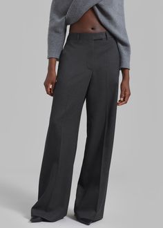 Color: Grey Melange Wool melange twill fabric Relaxed fit Wide leg Mid rise Travelers crease Adjustable waist with buttons Slant hip pockets Back welt pockets Belt loops Zip fly Hook and bar closure Unlined 100% Virgin Wool Professional Dry Clean Only By Róhe. Made in Lithuania Gray Full-length Bottoms For Business, Gray Full-length Business Bottoms, Tailored Gray Wide Leg Pants, Tailored Wide Leg Gray Pants, Tailored Full-length Gray Pants, Tailored Full Length Gray Pants, Business Casual Full-length Wide Leg Pants With Welt Pockets, Tailored Gray Straight Leg Pants, Gray Tailored Straight Leg Pants