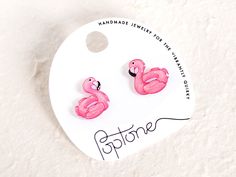 Make a splash with our cute handmade flamingo pool floatie stud earrings! These adorable accessories are perfect for anyone who loves the beach, pool parties, and a touch of playful in their wardrobe. Each earring is handmade and hand-illustrated, ensuring that no two are exactly alike. The earrings are coated in glossy resin and made with hypoallergenic nickel-free titanium earring posts - perfect for people with metal allergies! These earrings are highly water resistant, but please care for th Playful Pink Jewelry For The Beach, Handmade Pink Summer Jewelry, Playful Summer Birthday Jewelry, Pink Summer Jewelry For Gifts, Novelty Summer Jewelry Gift, Novelty Jewelry Gift, Pink Summer Style Jewelry For Gifts, Pink Summer Style Jewelry As A Gift, Playful Pink Earrings For Beach