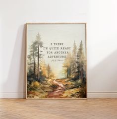 a painting on the wall in an empty room with a quote above it that reads, i think i'm quite ready for another adventure