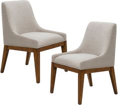 a pair of beige chairs sitting next to each other