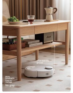 the robot is sitting on the floor next to a coffee table