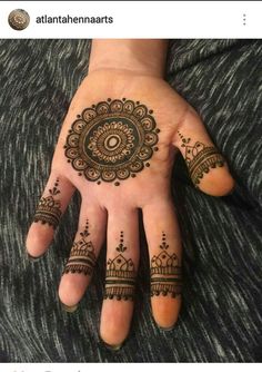 someone has henna tattoos on their hand