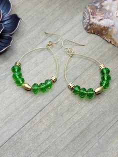 "Add a pop of color with these fun hoop earrings. *Faceted glass rondelle beads *Brass square beads *Ethiopian Elongated Brass Oval beads *Brass hoops *Brass ear hooks *Length measures 2.5\" *Created in studio - Wilmington, NC" Trendy Green Dangle Hoop Earrings, Green Teardrop Hoop Earrings For Everyday, Green Teardrop Nickel Free Hoop Earrings, Nickel-free Green Teardrop Hoop Earrings, Green Teardrop Nickel-free Hoop Earrings, Everyday Green Teardrop Hoop Earrings, Green Teardrop Hoop Earrings For Jewelry Making, Green And Gold Earrings, Teardrop Hoop Earrings