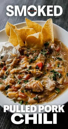 a white plate topped with chili and tortilla chips