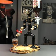 a miniature figurine made to look like a man holding a glass and bottle